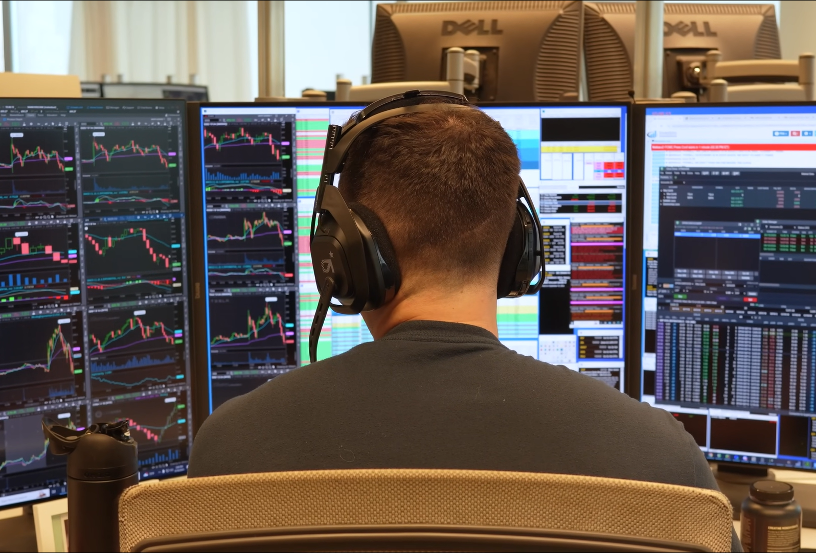 Trader at desk with monitors